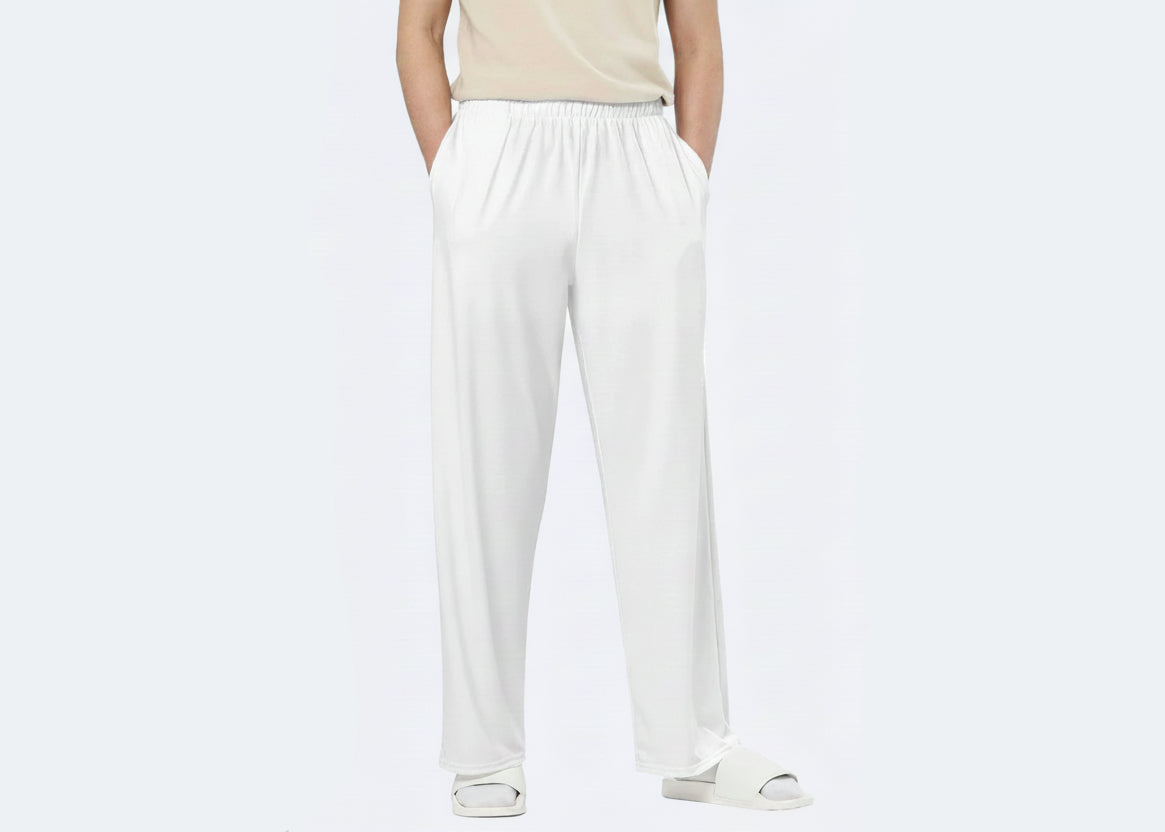 Person wearing white pants on a white background