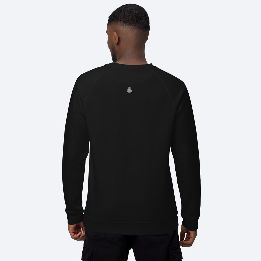 Person wearing a black sweatshirt with a logo on the back against a white background